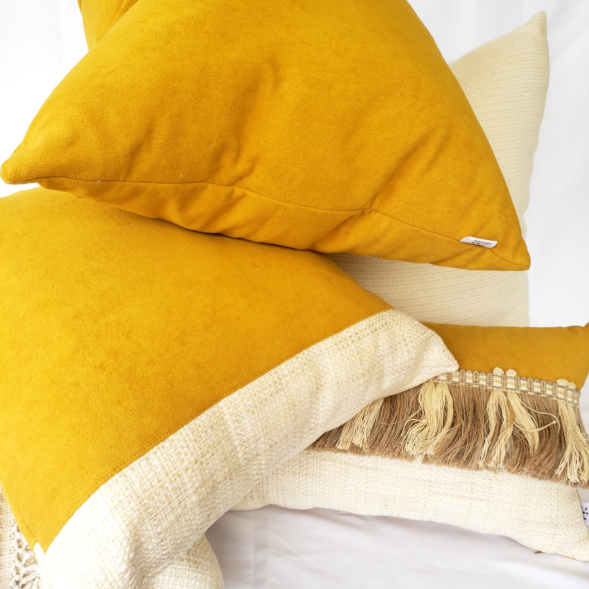 Experience the ultimate luxury with our Fiokim Mustard Deluxe tassels Lumbar Pillow Cover. Made from a soft, suede-like designer fabric in striking mustard yellow, this reversible cushion cover will add a touch of elegance to any room. The double-stitched and sealed edges ensure durability and the ivory and beige tassel accent adds a charming touch. Elevate your home decor with our must-have reversible lumbar pillow cover.
