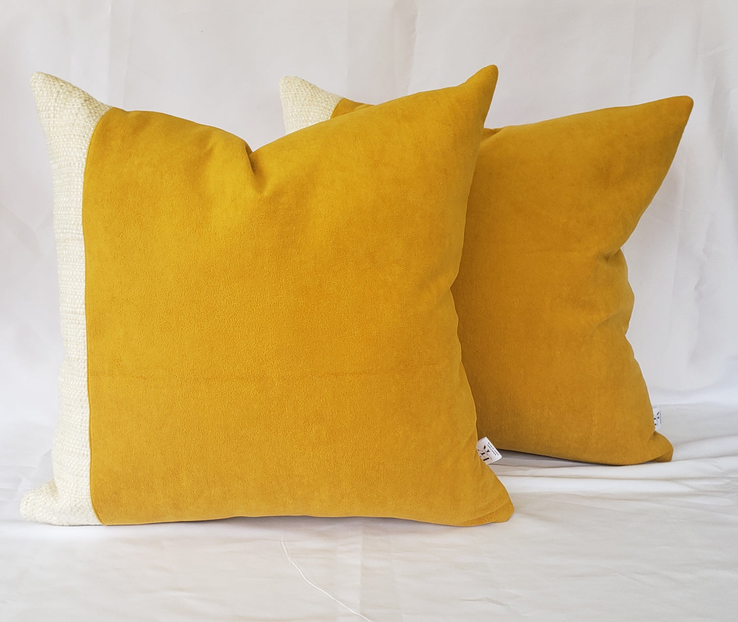 Elevate your home decor with our Fiokim Mustard Deluxe Square Pillow Cover. Crafted with luxurious mustard suede-like fabric, this designer pillow features a sophisticated woven ivory and beige design. Perfect for your sofa or bedroom, its matching reverse and double stitched, sealed edges add a touch of elegance. The invisible zipper ensures a seamless and polished look.
Advenique Home Decor luxury square pillows 