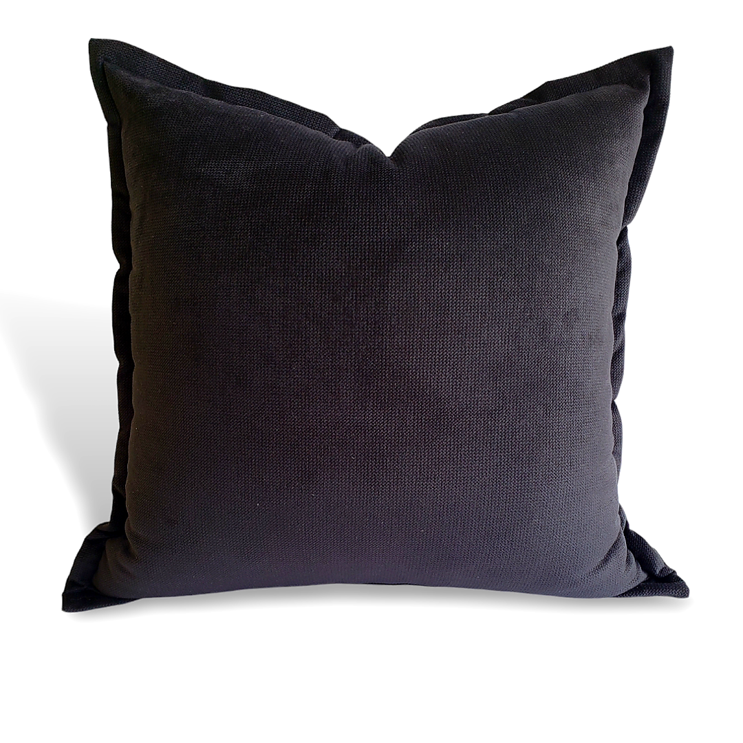 Add a bold and stylish touch to your home decor with this luxurious black pillow cover. Made with high-quality microsuede designer fabric, its flanged edges provide an elegant look while also making it versatile for any room. Make a statement and enhance your living space with this must-have accessory.