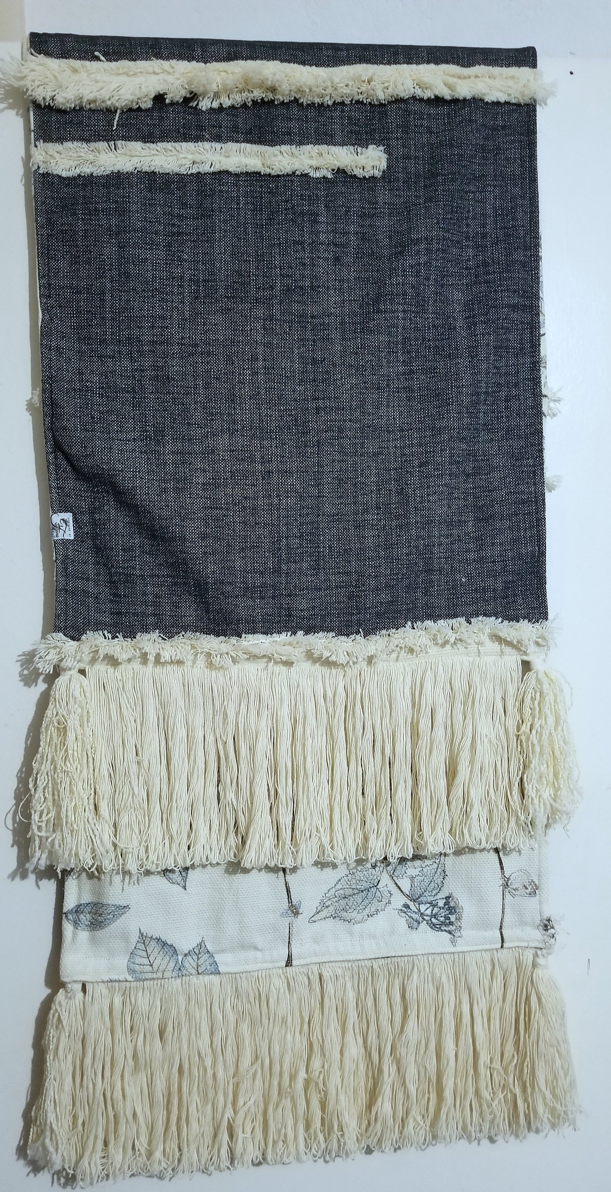 Bring effortless style to your home with this handmade limited edition luxury throw/runner. Woven in an intricate pattern of beige, black and blue, this 18x70 in piece is made from P Kaufmann Arboretum Fabric, with a woven reverse and tasseled edge. A truly unique piece for the boho decor enthusiast.  Free international shipping
