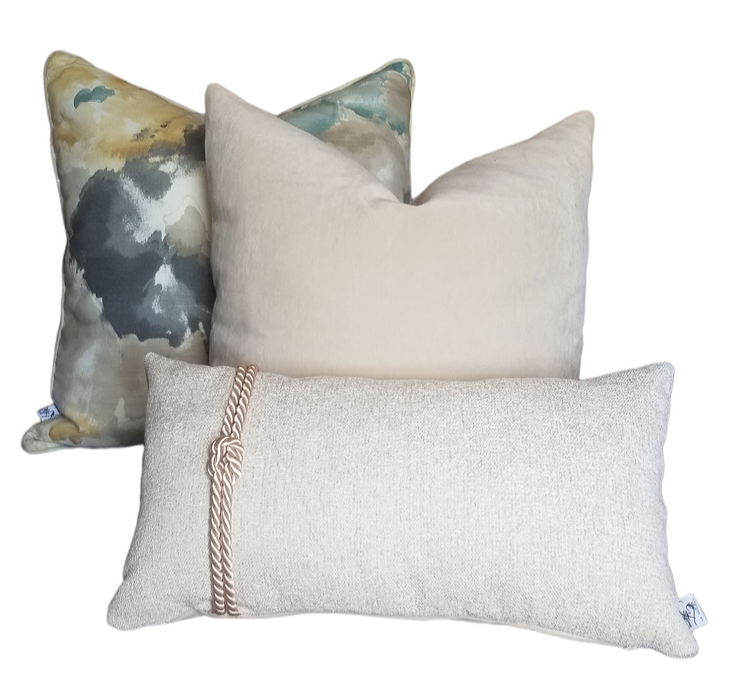 This beautiful designer throw pillow is perfect for adding a touch of nautical style to any room. The beige textured fabric features a rope knot detail, making it the perfect lumbar pillow cover for a beach-inspired look. The neutral color will coordinate with any existing décor, adding a touch of coastal charm.