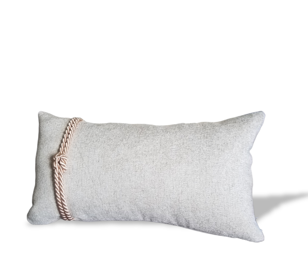This beautiful designer throw pillow is perfect for adding a touch of nautical style to any room. The beige textured fabric features a rope knot detail, making it the perfect lumbar pillow cover for a beach-inspired look. The neutral color will coordinate with any existing décor, adding a touch of coastal charm.